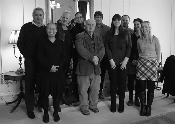 black and white photograph of the team and steering committee members. Ten people stood in a group and smiling at the camera!