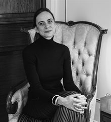 black and white photo of Anna Greenwood, seated.