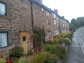 colour photograph of a row of cottages in Lea