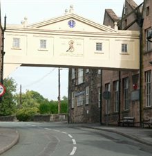 colour photograph of an elevated walkway over the road running between different parts of the Smedley factory.