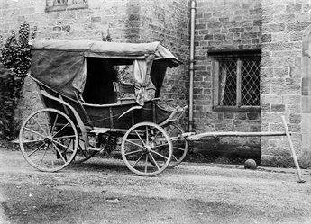 Black and white photograph of the carriage used as a field ambulance by Nightingale in the Crimea.